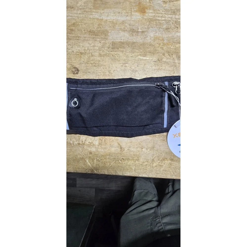 Xeasyr brand black running belt designed for carrying small essentials like phon